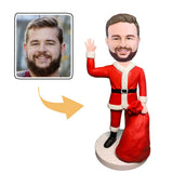 Santa Claus carrying a gift bag