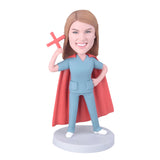 Nurse holding a red cross custom bobblehead
