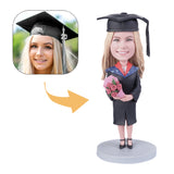 Female graduate holding flowers